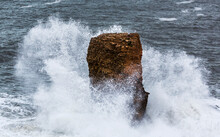 Waves Crashing Against A Rock Formation; South Shields, Tyne And Wear, England