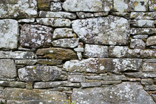 Close Up Of A Stone Wall With White Patches; Ireland