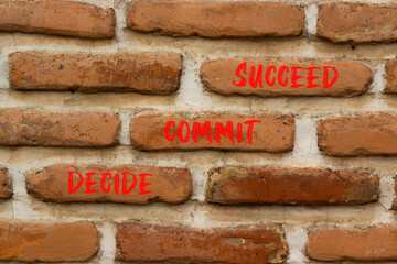 Wall Mural - Decide commit succeed symbol. Concept word Decide Commit Succeed on beautiful red brown bricks. Beautiful red brown brickwall background. Business decide commit succeed concept. Copy space.