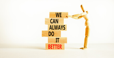 we make it better symbol. concept words we can always do it better on wooden block. beautiful white 