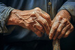 humanity and support in old age. A mature and wrinkled hand with a cane. Elderly care and senior delicate
