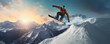© thejokercze - Snowboarder catching air off a snowy ramp with a mountain backdrop