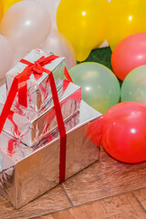 Wall Mural - A bunch of many New Year's gift boxes in silver packaging with a red ribbon birthday celebrate festive object