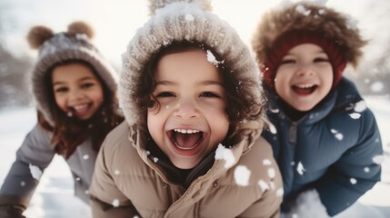 Poster - Happy group of children playing in the snow during winter.