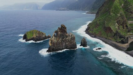 Wall Mural - Stunning aerial drone footage view of the Praia da Ribeira da Janela sea stacks in northern part of the island