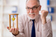 © Elnur - Old male employee in time management concept