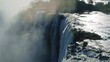 Aerial view Victoria Falls. Beautiful nature of Africa with a waterfall on the Zambezi River with tons of water falling