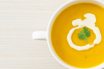 Canvas Print - pumpkin soup in white bowl