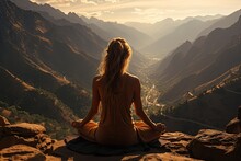 A Young Woman Practicing Yoga On A Mountaintop With A Magnificent View