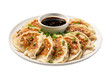 Pan-fried gyoza with dipping sauce on a white plate, isolated on white or transparent background.