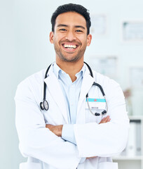 Wall Mural - Portrait of doctor with smile, arms crossed and healthcare, professional in hospital for support and help. Medicine, happy man with confidence and pride in medical career, expert surgeon in clinic.