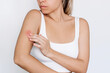 © Марина Демешко - Worried young woman touching an insect bite on her arm isolated on white background. A red rash caused by allergy, inflammatory process. Eczema, atopic dermatitis, lichen, allergy, itching, psoriasis