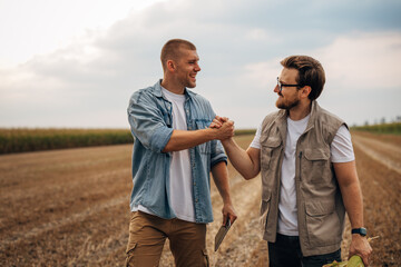 handshake between two men in the field