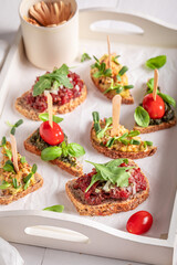 Wall Mural - Fresh bruschetta with tomato and pesto for breakfast