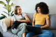 © aLListar/peopleimages.com - Dog, laptop or gay couple on sofa to relax together in healthy relationship love connection. Lgbtq, online or lesbian women with a pet animal to hug, play or bond on living room couch for remote work