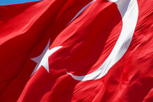 Flag Of The Republic Of Turkey, Turkish Flag Waving In The Wind, Blue Sky And The Flag Of The Republic Of Turkey,