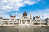 Fototapeta Lawenda - Beautiful view of Hungarian Government Parliament with blue sky.