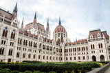 Fototapeta Lawenda - Budapest, Hungary, August 15, 2023. Beautiful Facade and Dome of Hungarian Parliament Building.