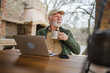 © Miljan Živković - One senior man sit outdoor in autumn day hold cup of coffee or tea