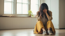 Sad And Depressed Young Woman Sitting On The Floor In The Living Room Looking Outside The Doors,sad Mood,feel Tired, Lonely And Unhappy Concept.