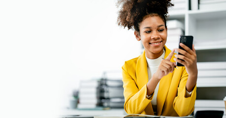 female employee african american.Do accounting paperwork using the phone at her work station. Businessman, freelance worker, online marketing report, e-commerce telemarketing concept.