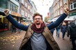 © Oleksii Halutva - Portrait of a joyful attractive man standing with an excited expression, raising his fists, shouting, yes, celebrating his victory, success