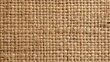 © Kanisorn - Woven straw mat texture background, presenting a natural, rustic aesthetic with intricate interlocking fibers. Great for eco-friendly product packaging and interior decor.