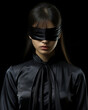© Vagner Castro - An intriguing portrait of a woman blindfolded by a velvet noir style fabric. Woman with blindfold and beautiful curves of her lips in an aura of suspense.
