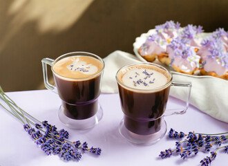 Two cups of coffee with lavender flowers on table, on light background. Generative AI