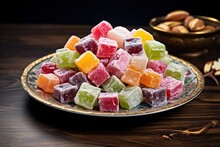 A Plate Filled With Assorted Candies Displayed On Top Of A Wooden Table. Perfect For Sweet Treats Or Confectionery Concepts.