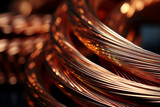 Fototapeta Młodzieżowe - A copper wire coil with a shiny surface and a dark background, creating a contrast of light and shadow