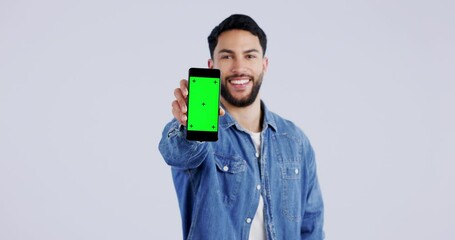 Poster - Happy man, face or green screen mockup on a phone for online branding or social media advertising. White background, smile or portrait of person pointing to mobile app chroma key logo space in studio