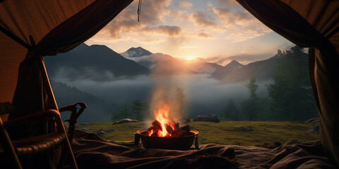 Canvas Print - view from inside a tent looking out, a small campfire in the foreground and a scenic mountain range 