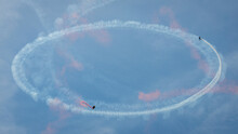 An Airplane And Skydiver Circling The Sky!