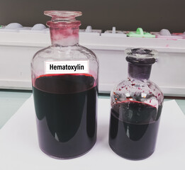 Sticker - Hematoxylin reagent after filtering for histology slide staining. Medical laboratory testing concept.