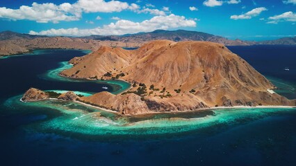 Poster - Komodo National Park during sunny calm day, Flores island, Indonesia. Aerial view of the tropical islands and lagoons with turquoise water