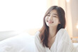© AspctStyle - Portrait of young Asian woman wake up in the morning, smiling pretty woman wakes up in her bed, feeling happy and fresh