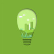 Sustainble city concept with bulb light and cityscape inside in paper cut out style vector illustration. 