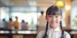 © sitifatimah - A little Asian schoolgirl radiating joy through her smile