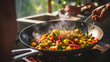 Close up of an asian indian woman's hands holding a frying pan and making a stir fry