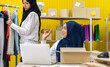 © Art_Photo - Muslim two asian woman freelancer sme business online shopping working and checklist order with cardboard box on table at home - Business online shipping and delivery concept