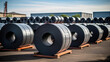 Rolls of carbon steel sheets outside the warehouse yard