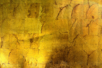 Scratched and damaged old gold background