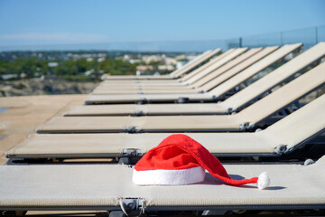 santa claus hat in a resort on summer vacation at christmas. Celebrating xmas in a hotel in december. Merry christmas