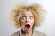Older woman with a surprised crazy look on her face. With glasses, funny image, white background, isolated
