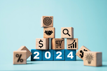 Wall Mural - 2024 on wooden block cube and business icons include hand shaking, target,percentage and lightbulb f