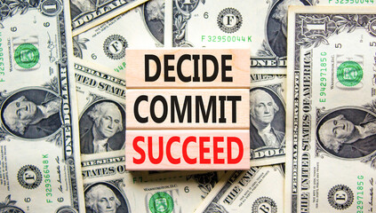 Wall Mural - Decide commit succeed symbol. Concept word Decide Commit Succeed on beautiful wooden block. Dollar bills. Beautiful dollar bills background. Business decide commit succeed concept. Copy space.