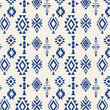 A vibrant blue and white pattern featuring intricate geometric shapes