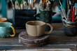 Handmade craft mugs in the pottery