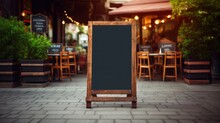 Wooden Rustic Blackboard In Front Of Restaurant Entrance. Mock Up Menu Blank Blackboard Sign Stand Shop Cafe Restaurant.